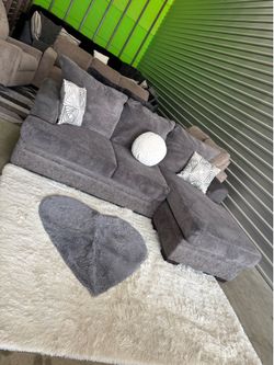 Grey sectional sofa couch with heart shaped rug(DELIVERY AVAILABLE)