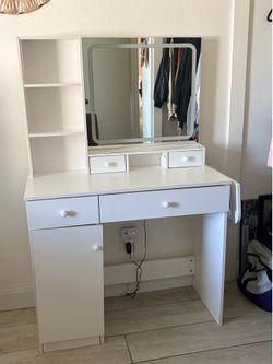 Vanity with mirror lights and outlet