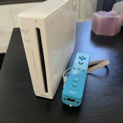 USED WII WITH 10 Games /1control ($80)