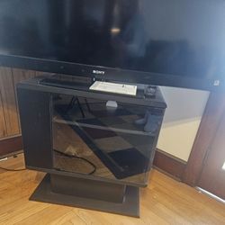 Very Nice Black TV Stand Has Storage In The Front And On The Side