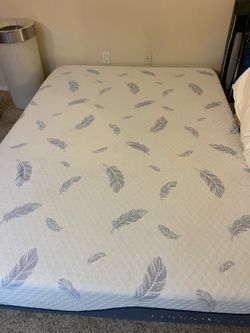 Plush queen mattress with bed frame