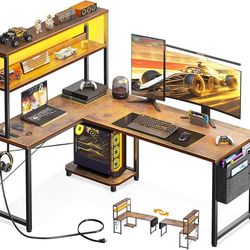 Dk190 $70  L Shaped Desk Gaming Desk with LED Light & Power Outlet, 43 Inch Reversible L Shaped Computer Table with Shelf, Corner Desk with Storage Ba