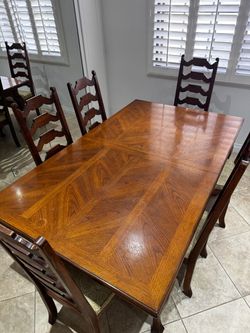 Used wood dining room table with 6 chairs