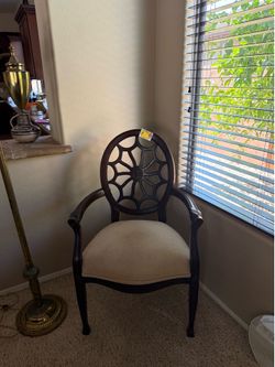 Elegant wooden accent chair with geometric back and cushioned seat