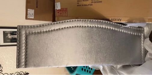 Gray Upholstered Headboard with Nailhead Trim  located in Sanger