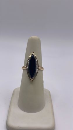 14k gold ring with CZ around the black oval