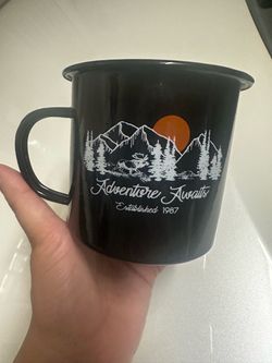 Adventure awaits coffee cup