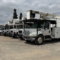 2008 GMC Boom Truck And Vermeer Wood Chippers