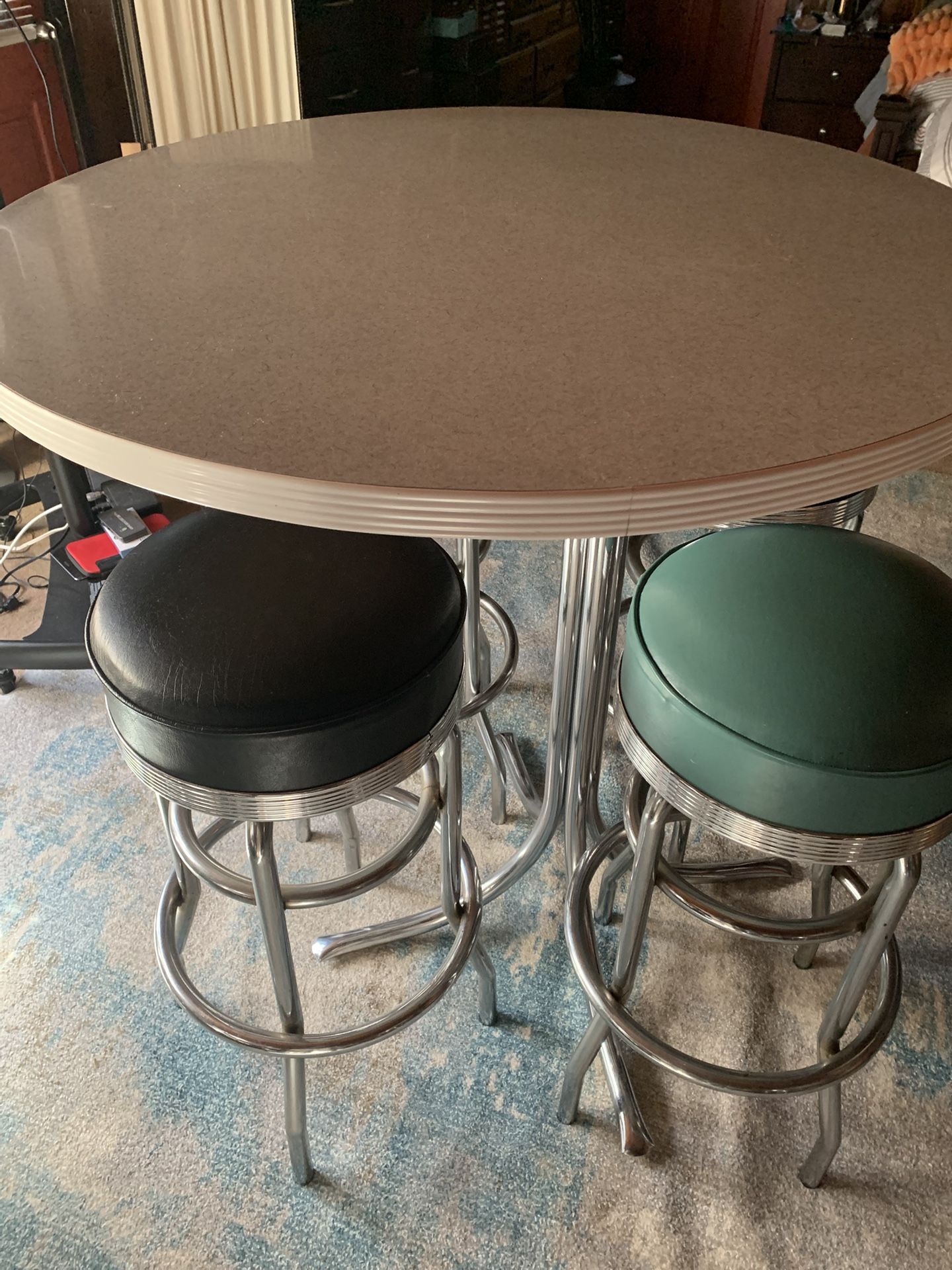 Table With Four Barstools 