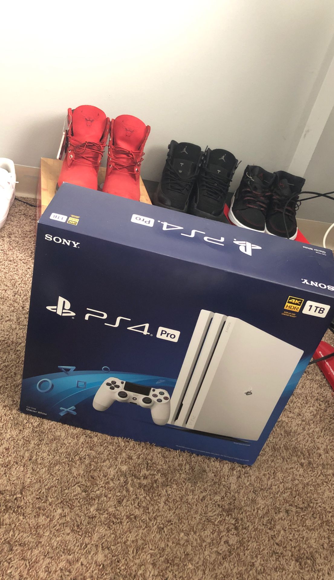 white ps4 pro with games