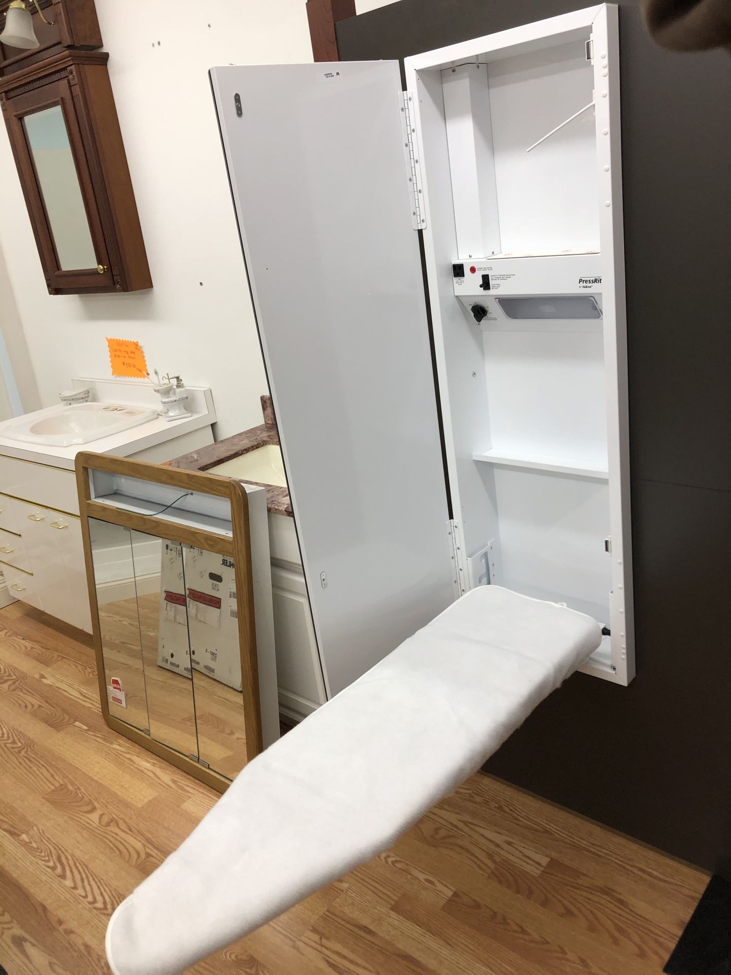 Nutone mirror with built in ironing center