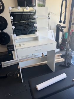 Vanity with lighted mirror