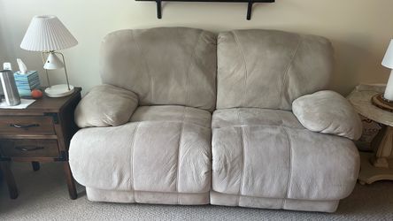 Beige Leather Reclining Loveseat