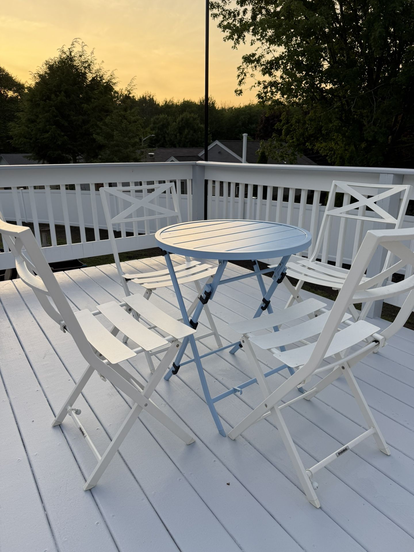 Metal table set with four chairs.