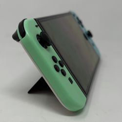 Nintendo Switch OLED Bundle – Console, Games, SD Card, Hardshell Case, HDMI, and Screen Protector