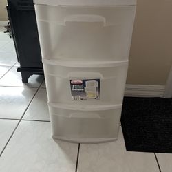3-drawer plastic cabinet in good and clean condition, measures 24 inches high, 14 inches wide, and 12.5 inches deep.