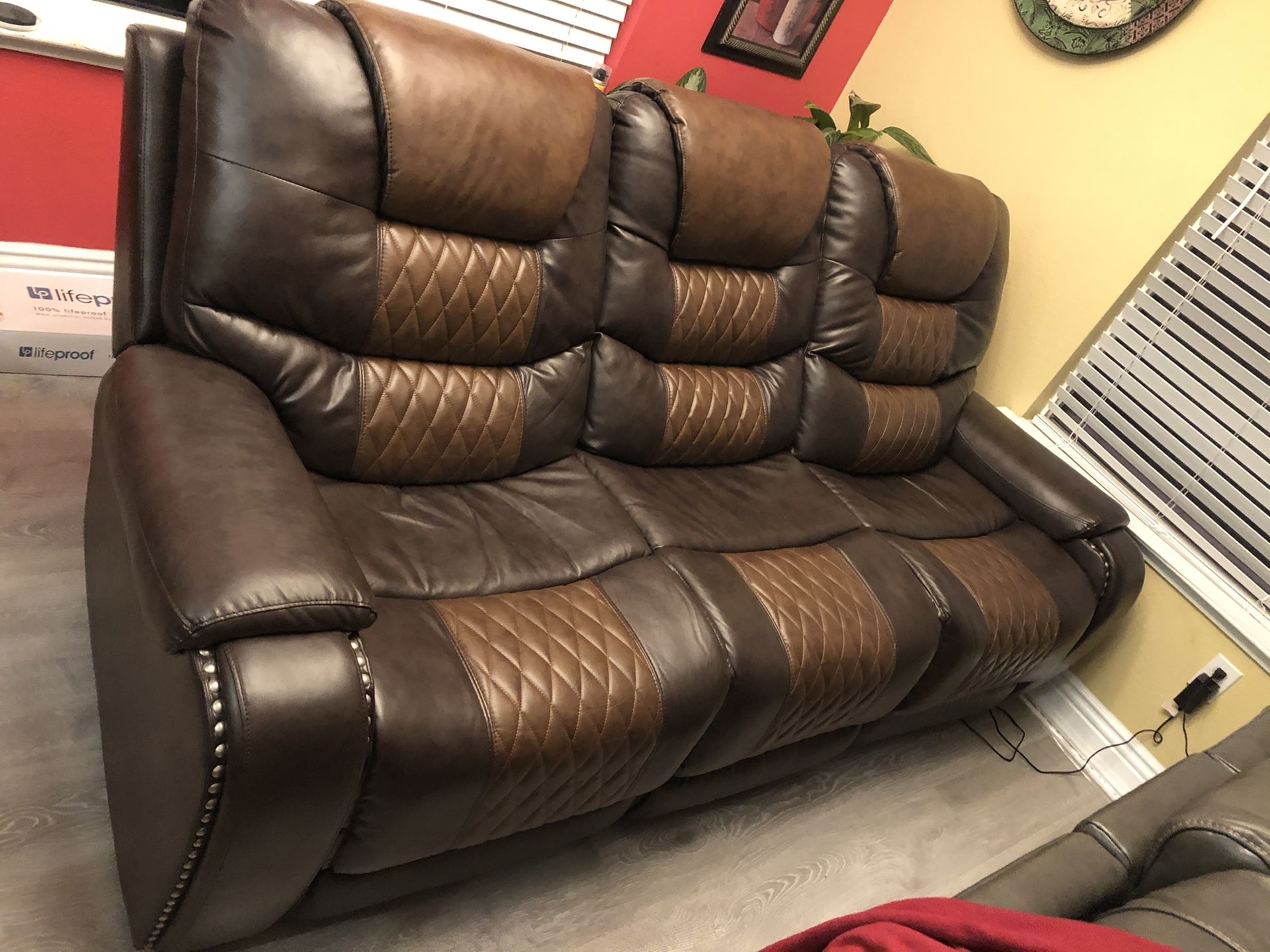 Two shade brown recliner, head, back and feet adjustable seats