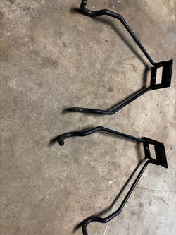 Flip up wall bike hangers