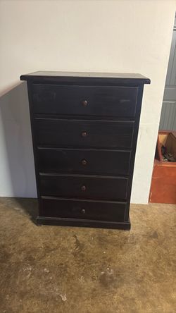 Tall brown dresser