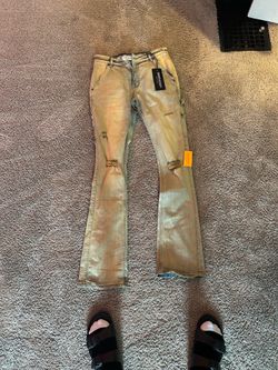 Stacked designer jeans
