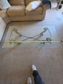 Glass coffee table with metal base