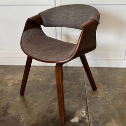 Modern Walnut Accent Chair with Curved Barrel Back