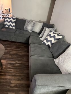 Sectional couch and center piece living room table for sale. In good condition