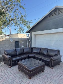 Elegant Brown Leather Sectional + Tufted Ottoman