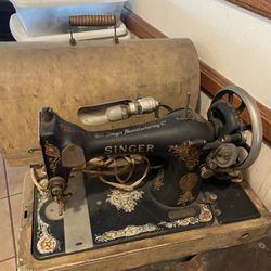 Pre-1930s Singer sewing machine in woodcase