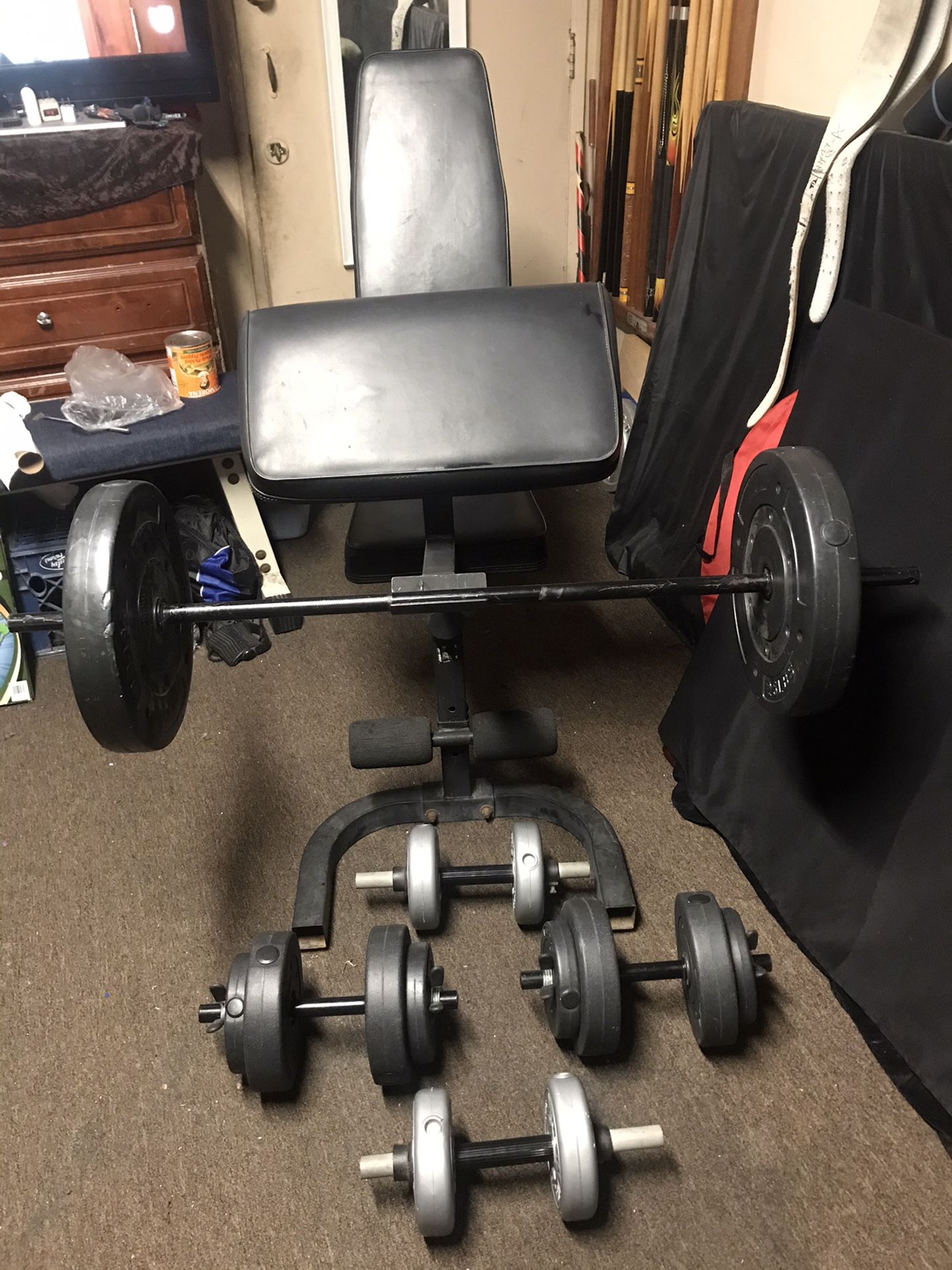 ADJUSTABLE WEIGHT CURL BENCH and DUMBBELLS and BAR is 4ft LONG and 100 LBS PLATES
