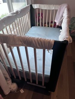 Beautiful black Used crib. No structural issues but paint chipped on top