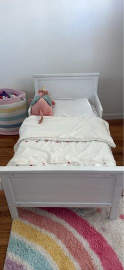 Toddler bed (white) with Serta toddler mattress.