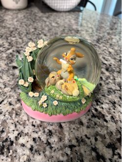 Beautiful Disney snow globes with music boxes. Obsolete.