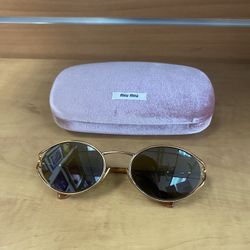  Miu Miu MU sunglasses in a gold metal Frame