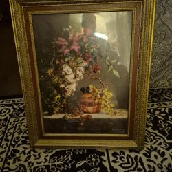 ANGLE WITH FLOWER AND GRAPES