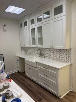 Kitchen cabinets, brand, new kitchen sink, brand new Marvel sink, cover, and island