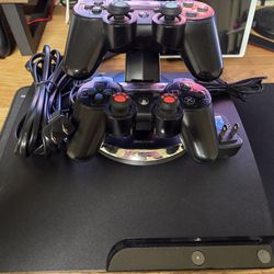 Playstation 3 Slim 1TB, 2 Controllers, And Charger