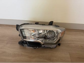 3rd gen Tacoma headlight  OEM driver side - 2016-2023