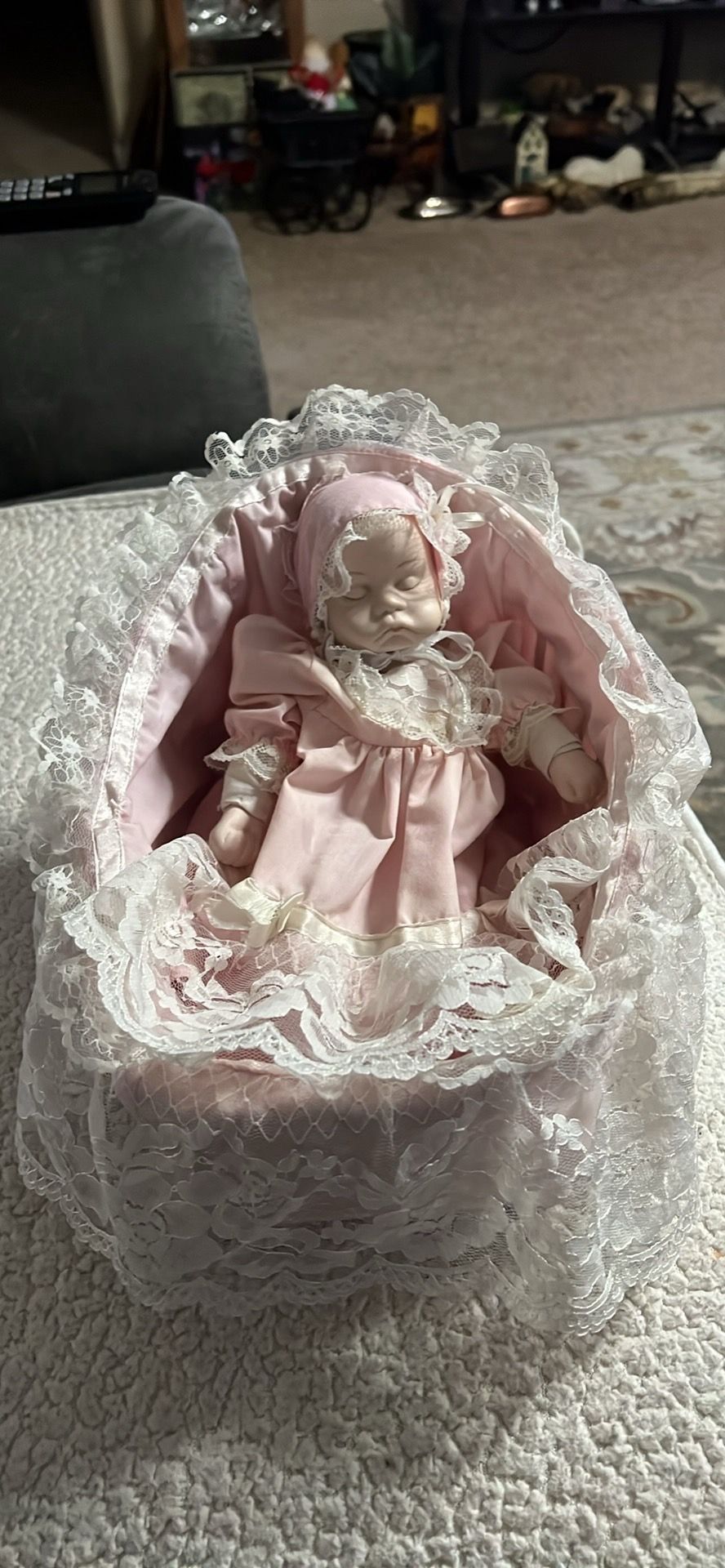 Vintage wind up musical doll in bassinet