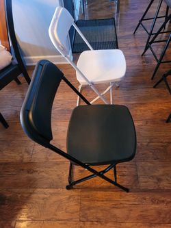 NEW! FOLDING CHAIRS WHITE AND BLACK.  FINANCING AVAILABLE 