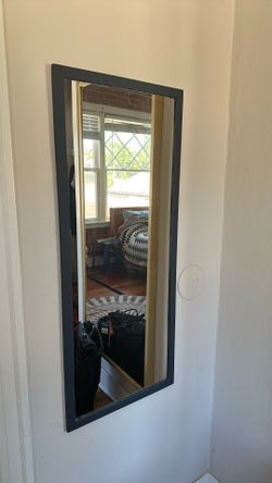 Mirror with wooden frame