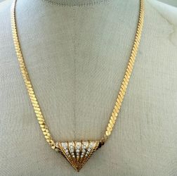Elegant gold-toned herringbone chain necklace with a central fan-shaped pendant.