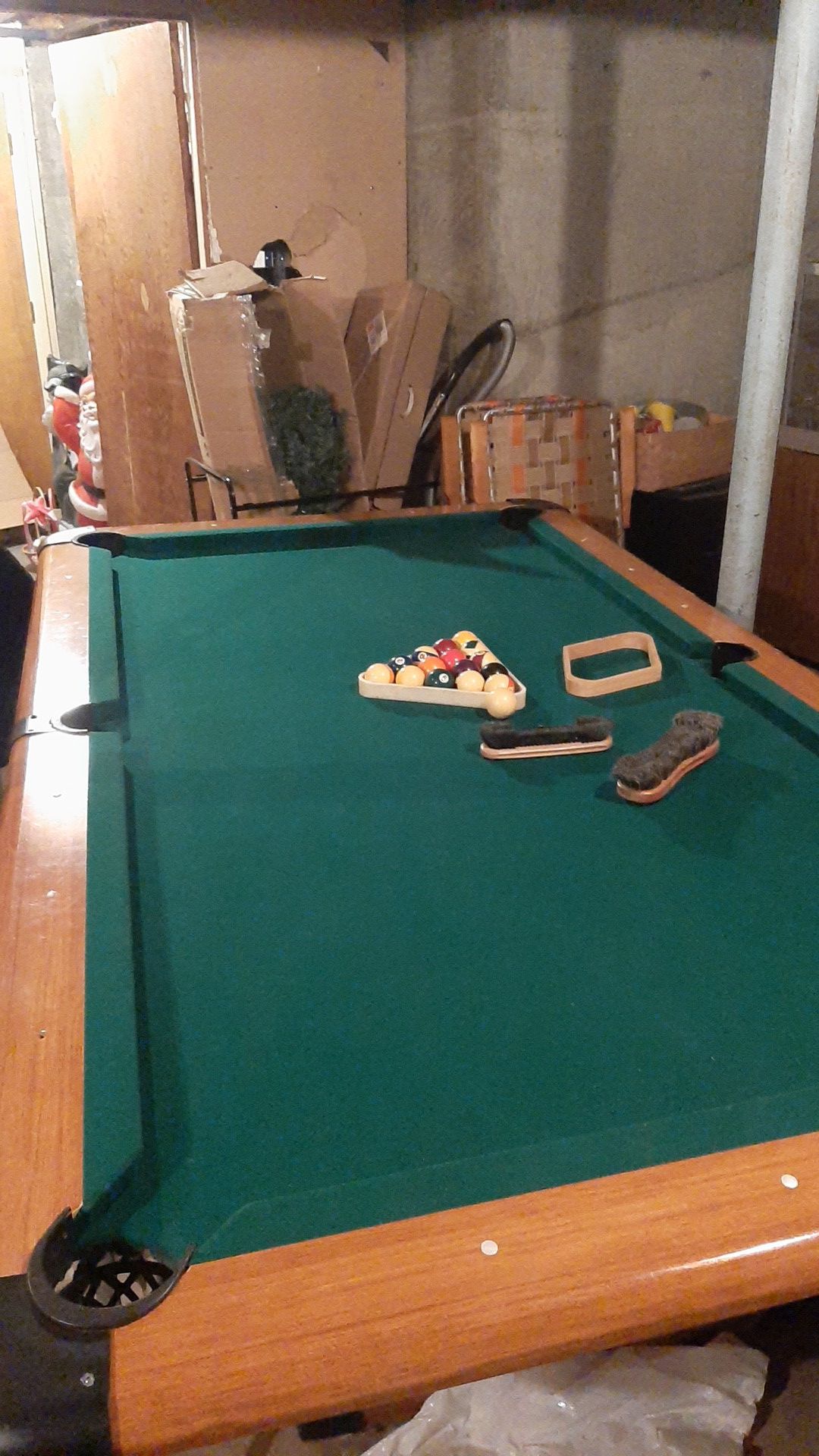 Pool table with sticks and balls