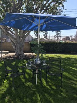 Table with chairs and umbrella
