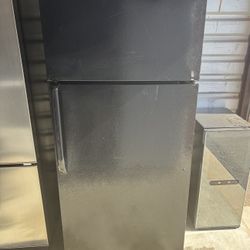 Black GE Refrigerator And Freezer