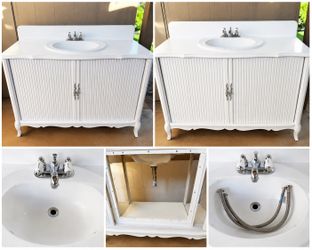 Vanity unit with sink and faucet in very good condition; 45 wide, 30 high, 20 deep.