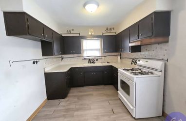 Free kitchen cabinets with counter, sink & faucet.