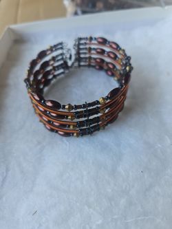 Neclace,bracelet, and earrings set , a braclet and a neclace