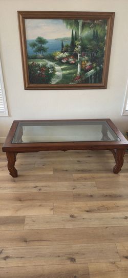 Large solid wood coffee table with glass top
