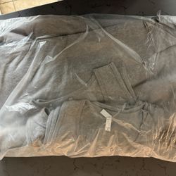 10 Unused Grey Tee Shirts.  Sleeveless 